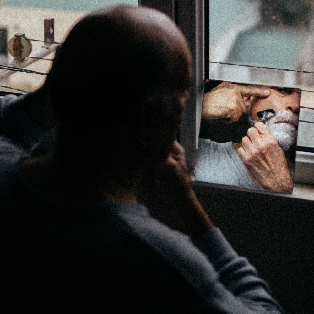 Man shaving with a double edge razor